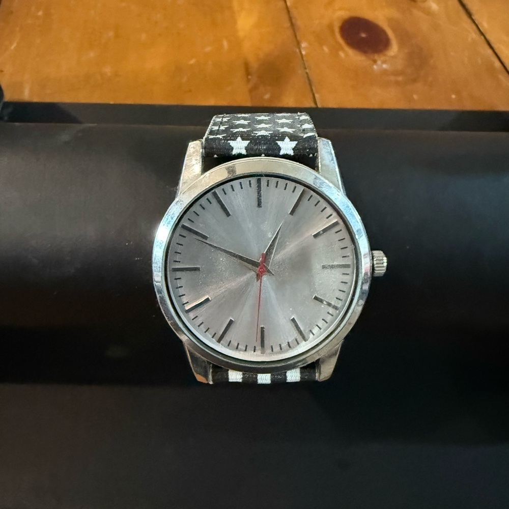 Elegant Silver Watch with Black Star Strap